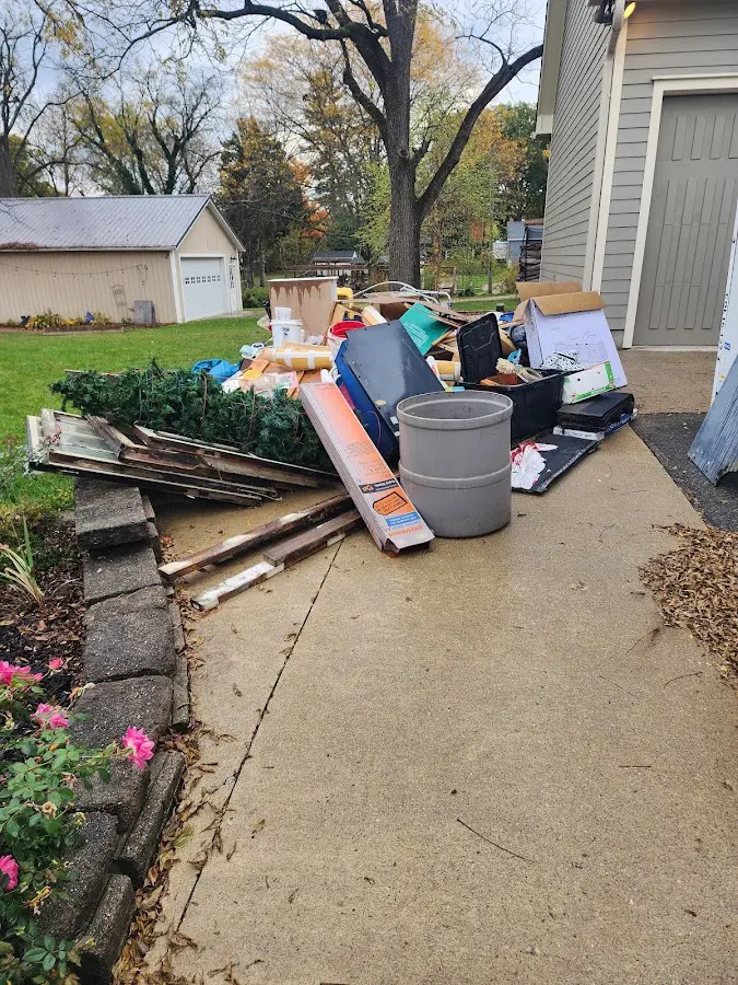 Dumpster being loaded with debris for Commercial Dumpster Rental in Trussville